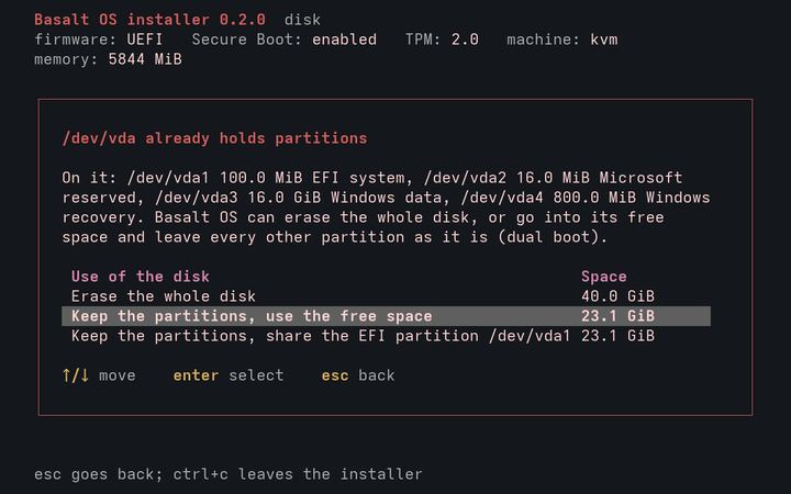 Text installer listing the partitions already on the disk and the choice to keep them and install in the free space.