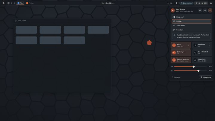 Mockup of a quick settings panel with suspend, restart, shut down and log out, a note about updates, toggles and sliders.